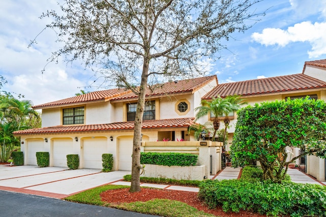 mediterranean / spanish-style house featuring a garage