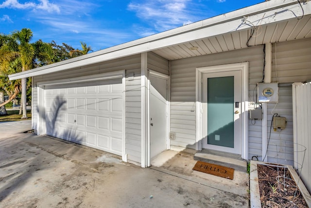 entrance to property with a detached garage