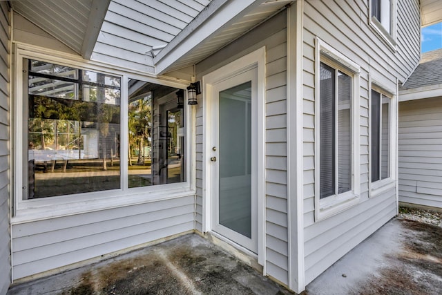 entrance to property with a patio