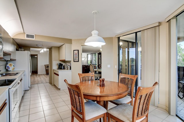 tiled dining space with sink