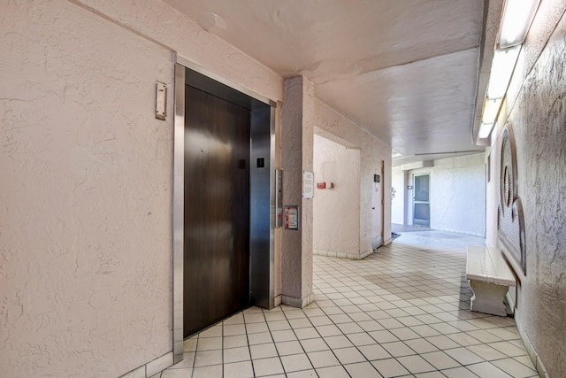 hallway featuring elevator