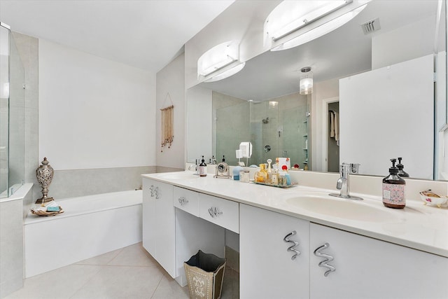 bathroom featuring vanity, independent shower and bath, and tile patterned flooring