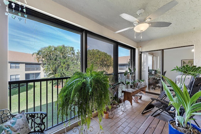 sunroom / solarium with ceiling fan