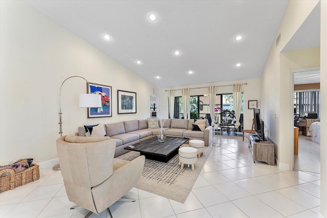 tiled living room with high vaulted ceiling