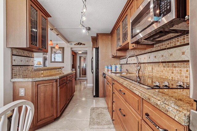 laundry room with stacked washer / drying machine