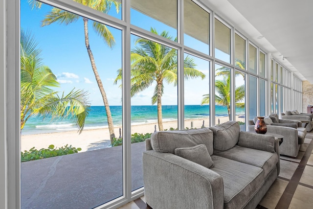 interior space featuring a view of the beach and a water view