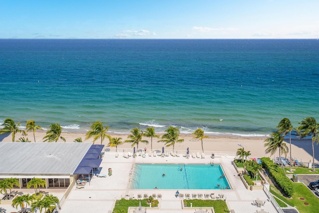 bird's eye view featuring a water view and a view of the beach