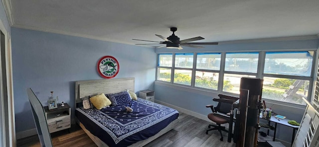 bedroom with ornamental molding, dark hardwood / wood-style floors, and ceiling fan