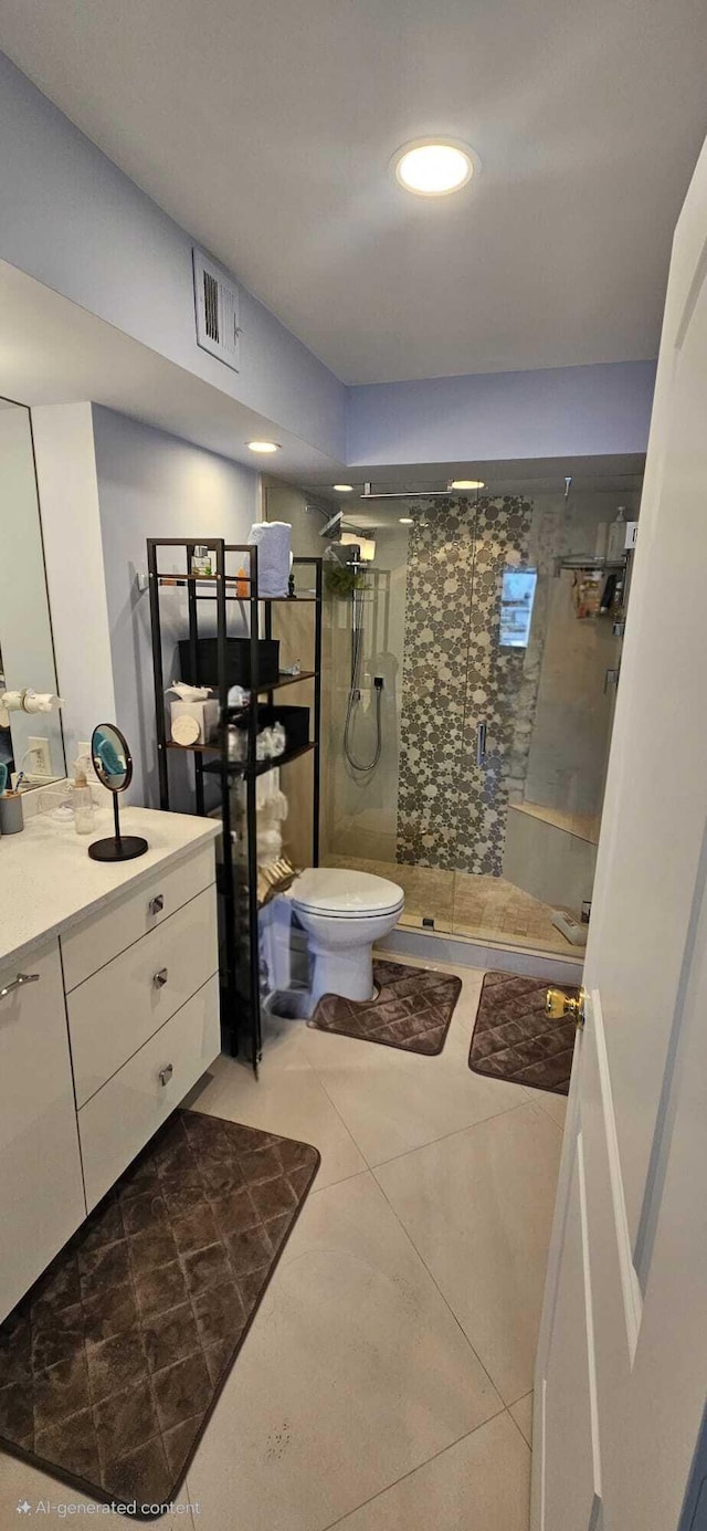 bathroom featuring an enclosed shower, vanity, tile patterned floors, and toilet