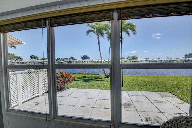 entryway featuring a water view and plenty of natural light