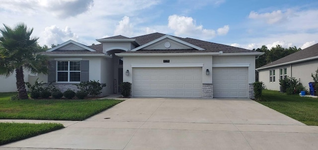 view of front of house with a garage and a front yard