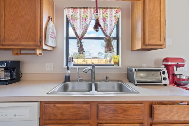 kitchen with sink and white dishwasher