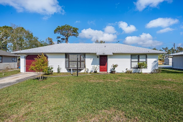 single story home featuring a garage and a front yard