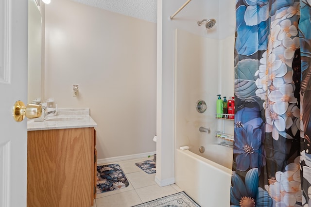 bathroom with vanity, tile patterned flooring, shower / bath combo with shower curtain, and a textured ceiling