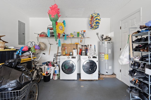 garage featuring washing machine and dryer, water heater, and electric panel