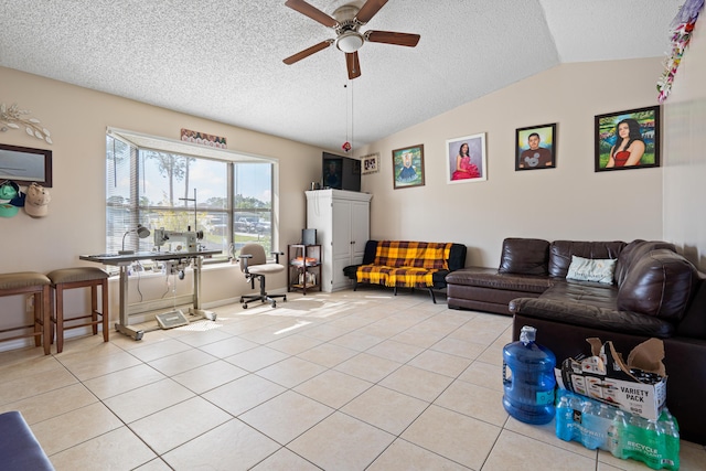 living room featuring lofted ceiling, light tile patterned floors, and a textured ceiling