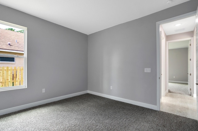 empty room featuring carpet floors