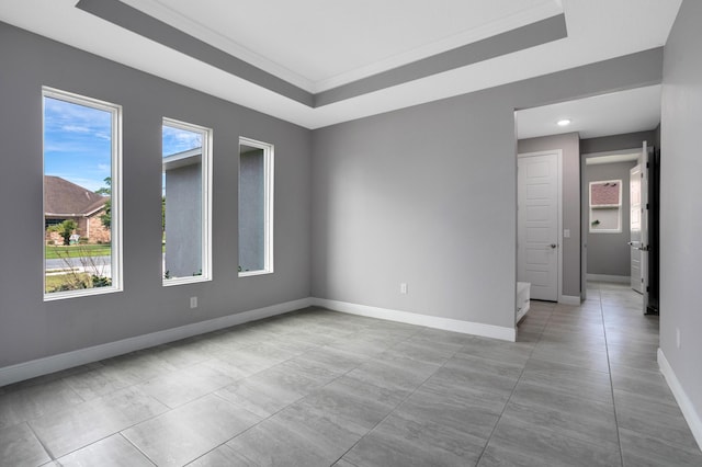 empty room with a raised ceiling