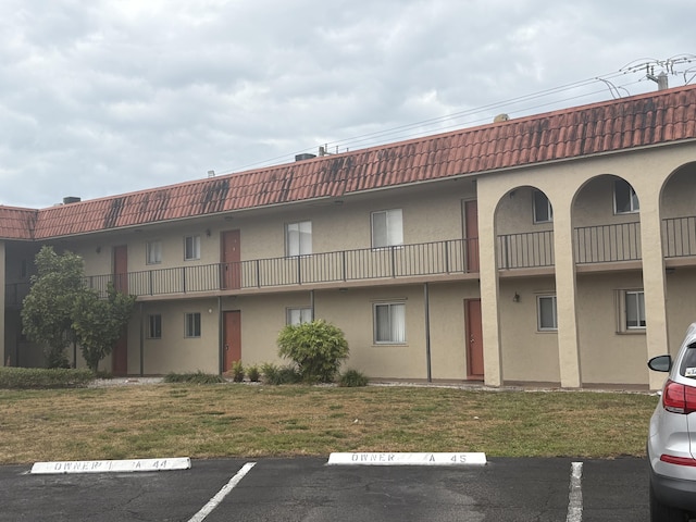 view of property with uncovered parking