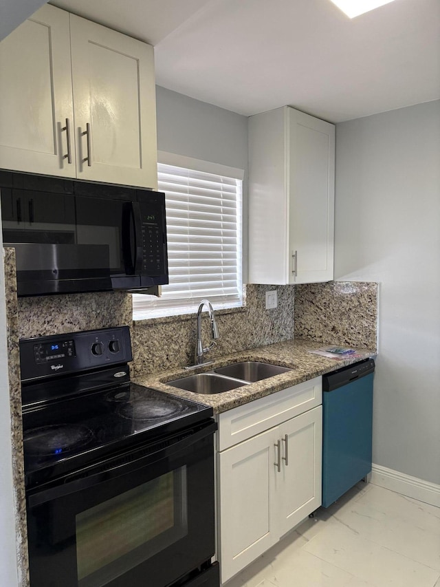 kitchen with white cabinetry, black appliances, tasteful backsplash, and a sink