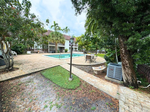 view of pool featuring a fenced in pool, a patio, and fence