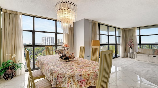 dining area with expansive windows, an inviting chandelier, and a textured ceiling