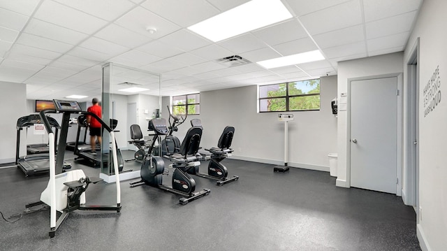 gym featuring a paneled ceiling