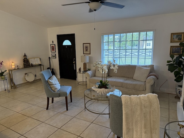 living room featuring light tile patterned floors and ceiling fan