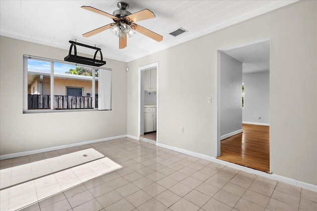 unfurnished room featuring light tile patterned floors and ceiling fan