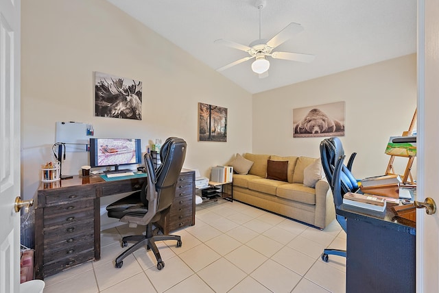 home office with lofted ceiling, light tile patterned floors, and ceiling fan