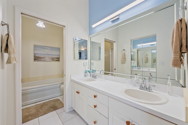 full bathroom with tile patterned floors, toilet, separate shower and tub, and vanity