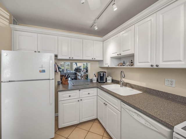 kitchen featuring white cabinetry, sink, white appliances, and light tile patterned floors