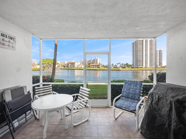 sunroom with a water view