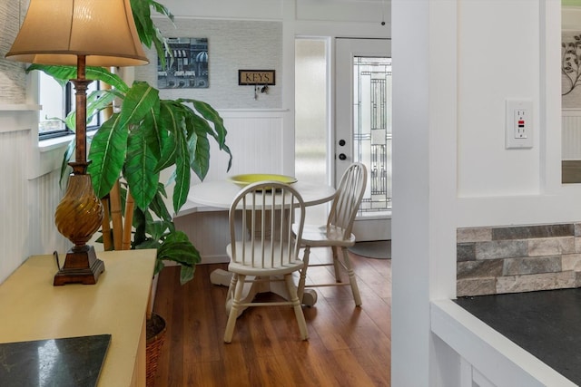 sitting room with wood-type flooring