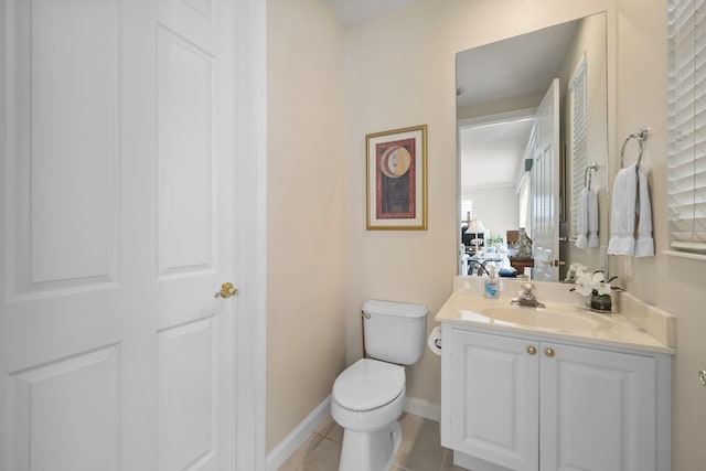 bathroom featuring tile patterned flooring, vanity, and toilet