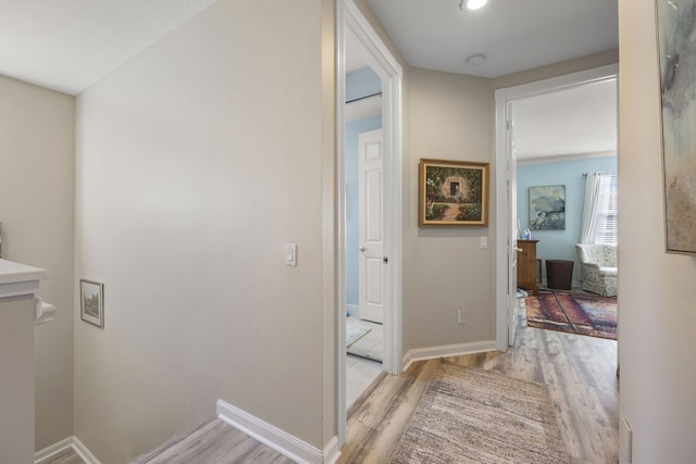 hall with light wood-type flooring