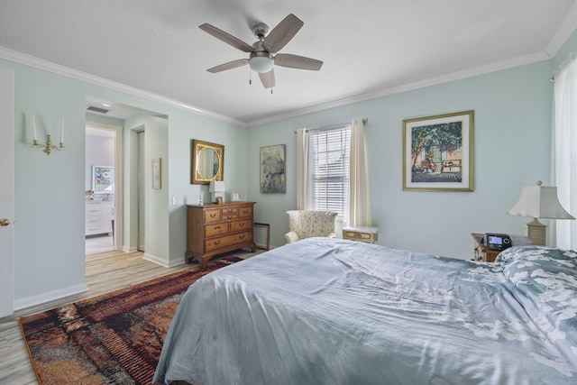 bedroom featuring crown molding, ceiling fan, and light wood-type flooring