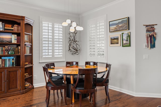 dining area with dark wood-type flooring and ornamental molding