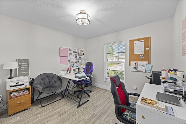 office space featuring a textured ceiling