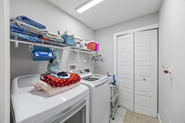 clothes washing area featuring washing machine and dryer