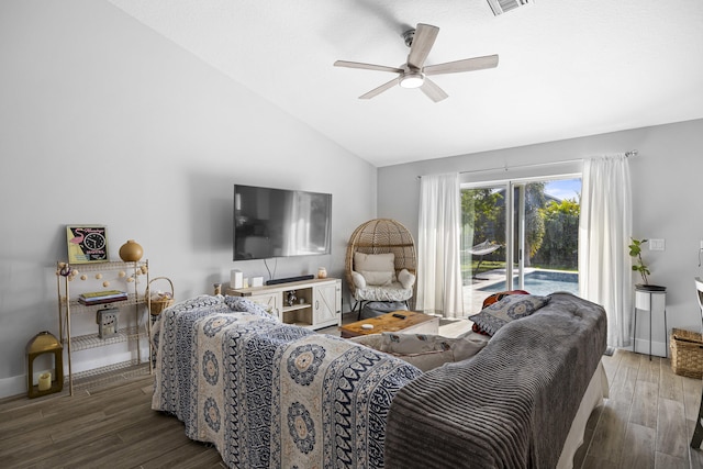 living room featuring wood-type flooring, vaulted ceiling, and ceiling fan