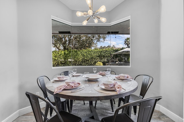 dining area with a healthy amount of sunlight and a chandelier