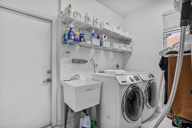 laundry area featuring tile patterned floors and independent washer and dryer