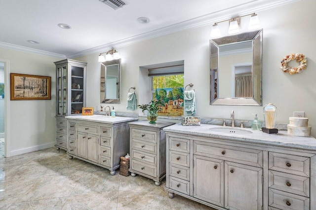 bathroom featuring crown molding and vanity