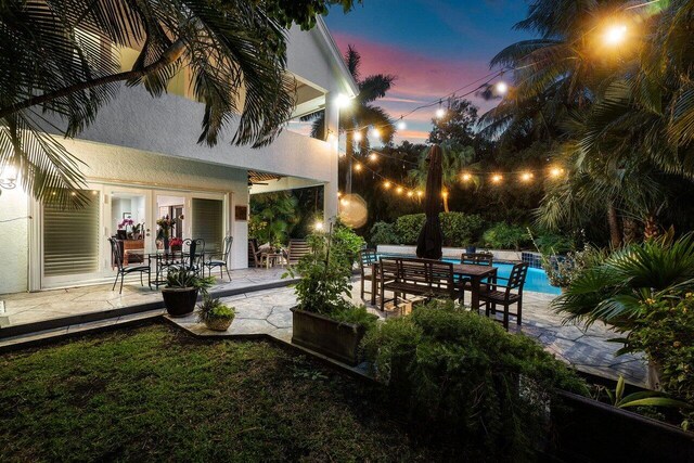 view of patio terrace at dusk