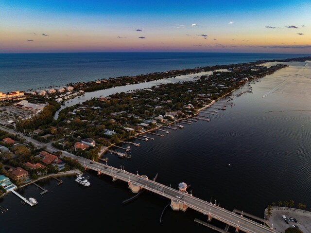 aerial view at dusk with a water view