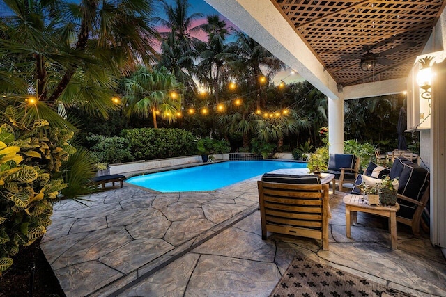 view of pool with a patio, outdoor lounge area, and ceiling fan