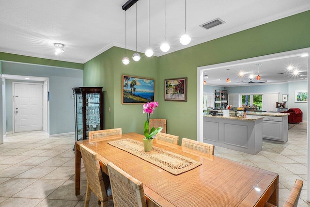 tiled dining area with crown molding