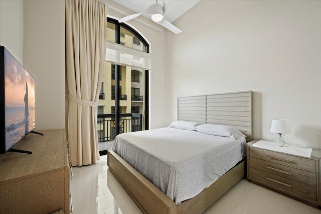 bedroom featuring lofted ceiling and access to exterior