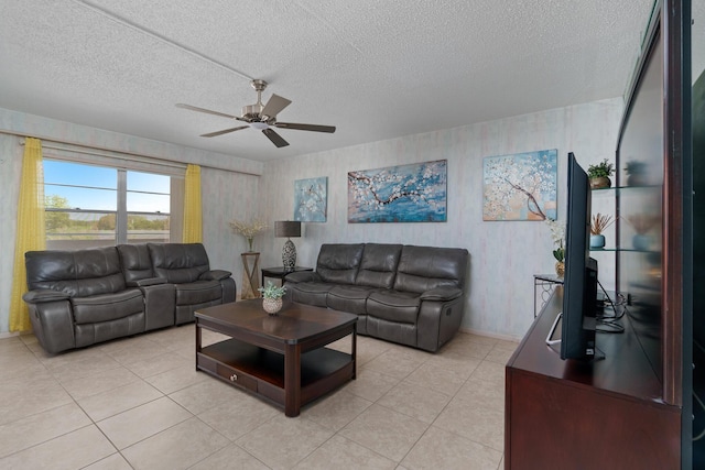 tiled living room featuring ceiling fan and a textured ceiling